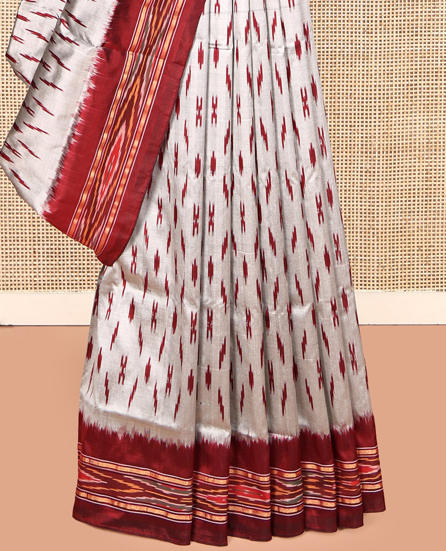 Grey-Red Pochampally Ikat Silk Saree, Adorned with Ikat Buttas, Complemented by a Contrast Ikat Border, Ikat-Style Pallu, and No Blouse