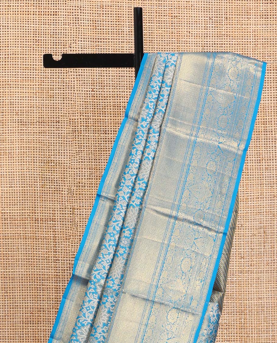 Blue Kanchipuram Tissue Silk Saree, Elegantly Framed with Jacquard Designs on Its Body, Highlighted by a Zari Border of Traditional Designs, Intricately Designed Pallu, and Paired with a Matching Blouse