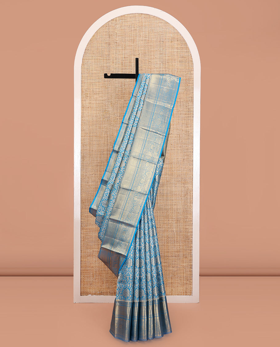 Blue Kanchipuram Tissue Silk Saree, Elegantly Framed with Jacquard Designs on Its Body, Highlighted by a Zari Border of Traditional Designs, Intricately Designed Pallu, and Paired with a Matching Blouse
