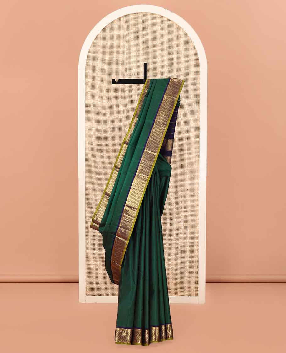 Green Plain Kanchipuram Silk Saree, Complemented by Contrast Border of Thilakam Mokku, and Rudraksham Designs, Pallu of Zari Designs, and Paired with a Contrast Blouse