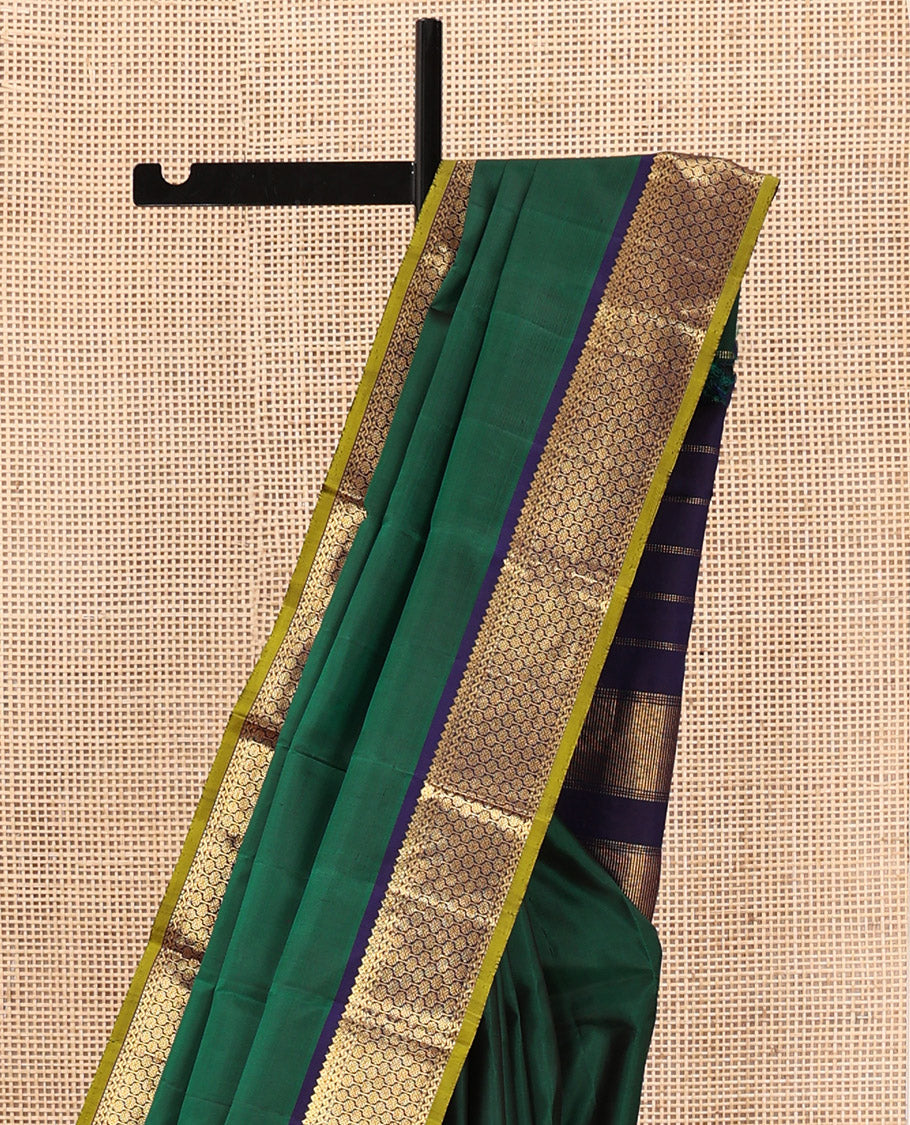 Green Plain Kanchipuram Silk Saree, Complemented by Contrast Border of Thilakam Mokku, and Rudraksham Designs, Pallu of Zari Designs, and Paired with a Contrast Blouse