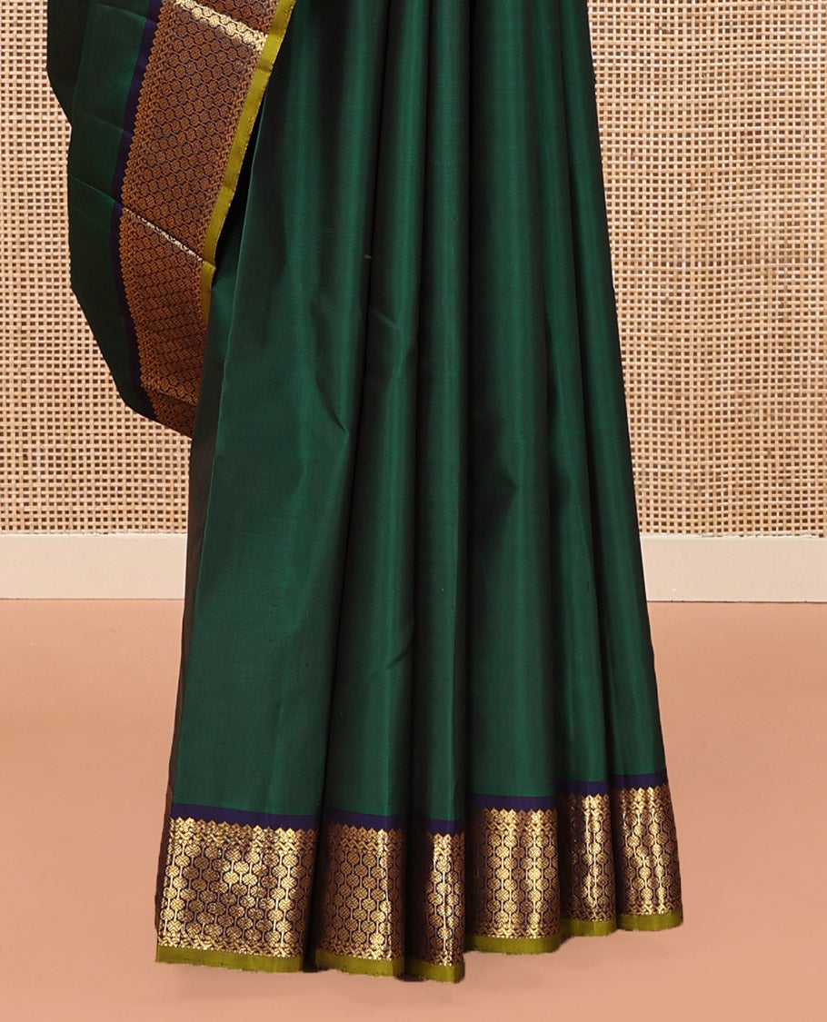 Green Plain Kanchipuram Silk Saree, Complemented by Contrast Border of Thilakam Mokku, and Rudraksham Designs, Pallu of Zari Designs, and Paired with a Contrast Blouse