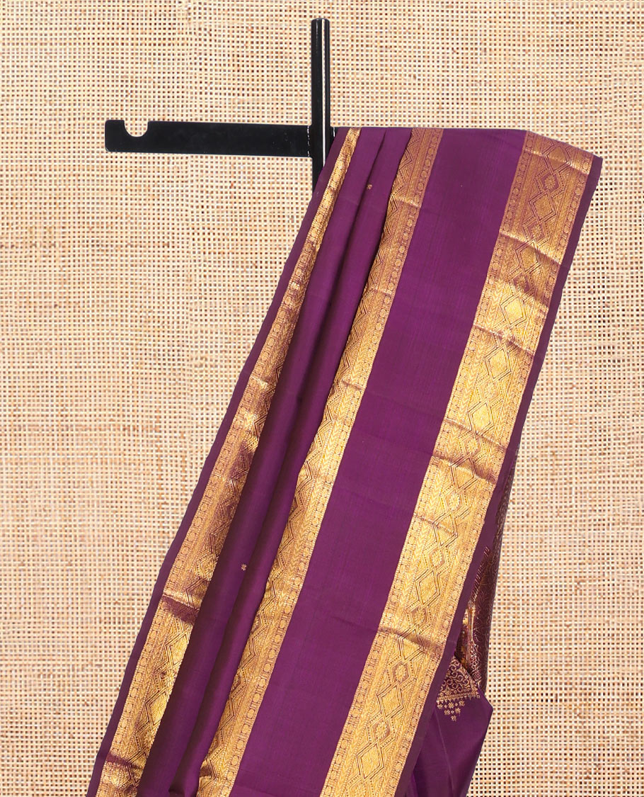 Purple Kanchipuram Silk Saree, Accentuated with Zari Buttas, Highlighted by Zari Rettai Pettu Border of Thazampoo Rekku, Muthu, Poun, and Diamond Designs, Manga Pallu, and Matching Blouse