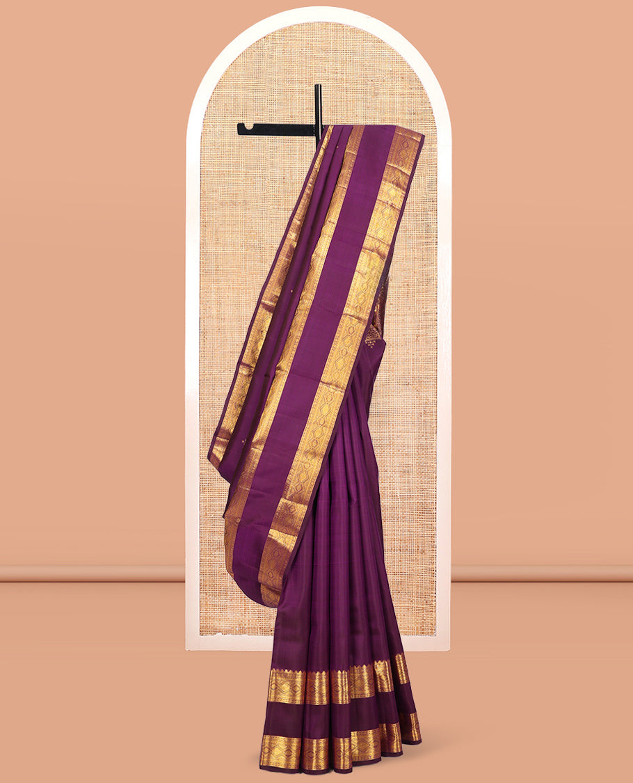 Purple Kanchipuram Silk Saree, Accentuated with Zari Buttas, Highlighted by Zari Rettai Pettu Border of Thazampoo Rekku, Muthu, Poun, and Diamond Designs, Manga Pallu, and Matching Blouse