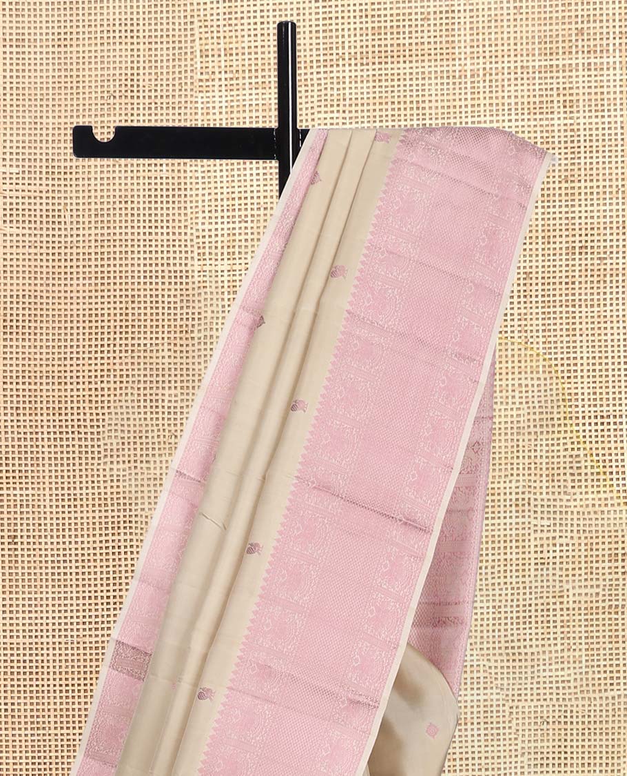 Beige Kanchipuram Silk Saree, Beautifully Bedecked with Thread Buttas, a Self-Border of Thilakam Mokku, Iruthalai Pakshi, and Kuyil Kann, Jaal Pallu, and a Matching Blouse