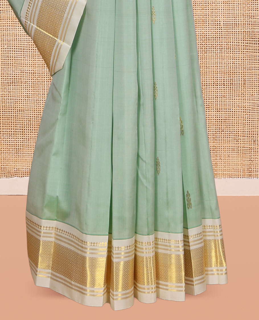 Pale Green Kanchipuram Silk Saree, Woven with Zari Buttas, Complemented by a Contrast One-Sided Border of Panner Sombu, Banaras, and Mayil Kann Designs, Zari Woven Pallu, and a No Blouse
