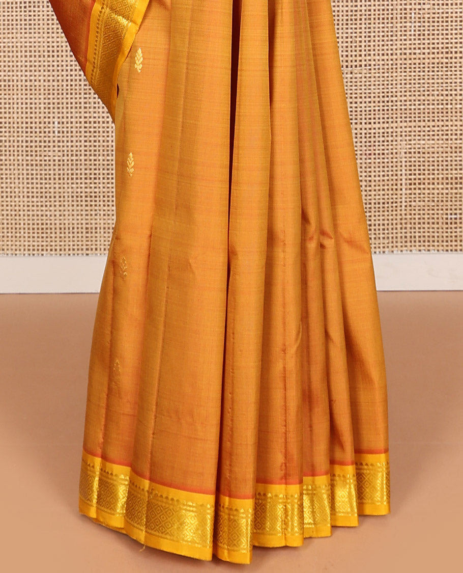 Orange floral buttas kancheepuram silk saree with contrast border of zari design border & floral design pallu