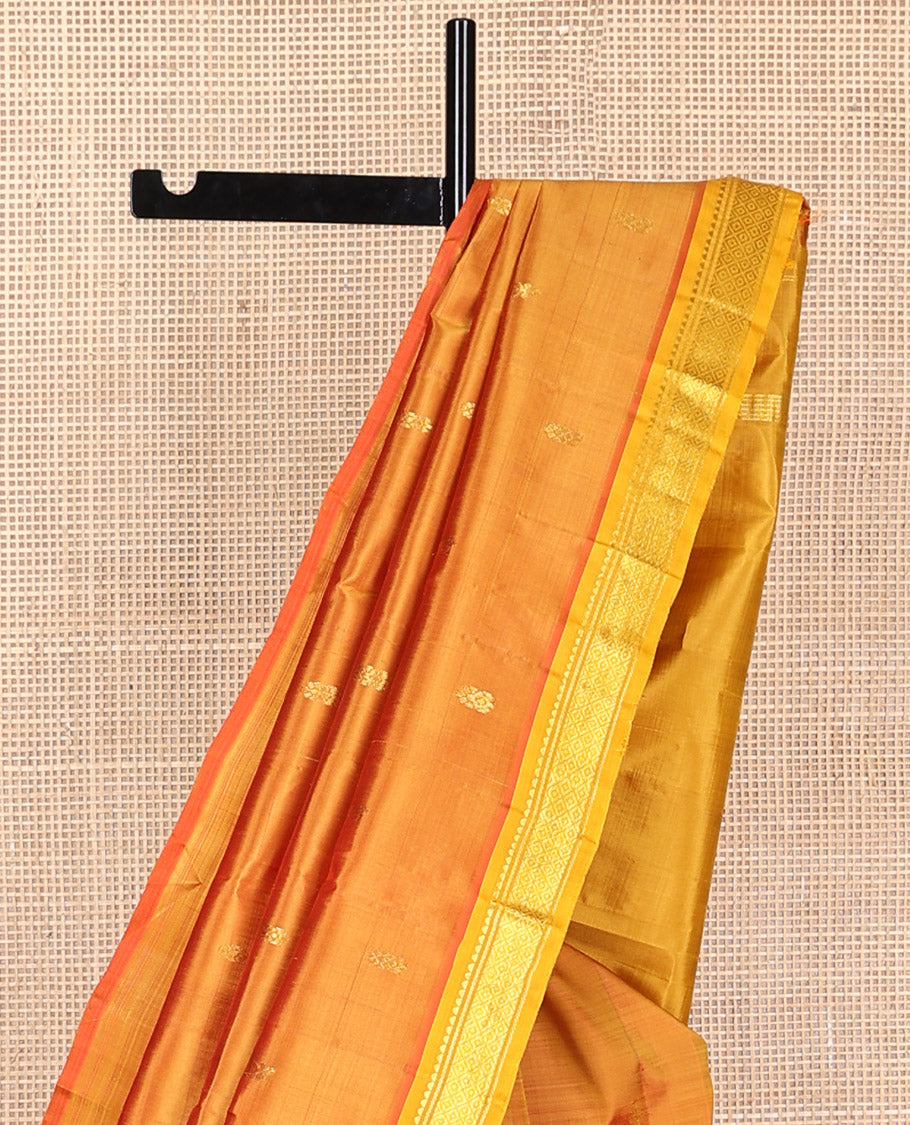 Orange floral buttas kancheepuram silk saree with contrast border of zari design border & floral design pallu