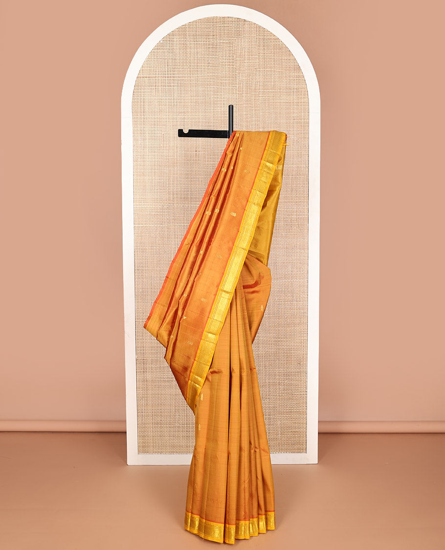 Orange floral buttas kancheepuram silk saree with contrast border of zari design border & floral design pallu