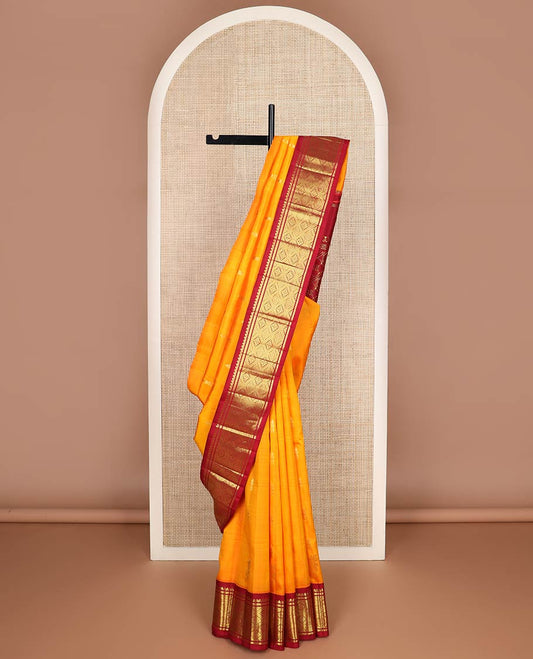 Mango yellow zari buttas kanchipuram silk saree, contrast one-sided korvai border of salngai,banaras & jaal & intricate pallu