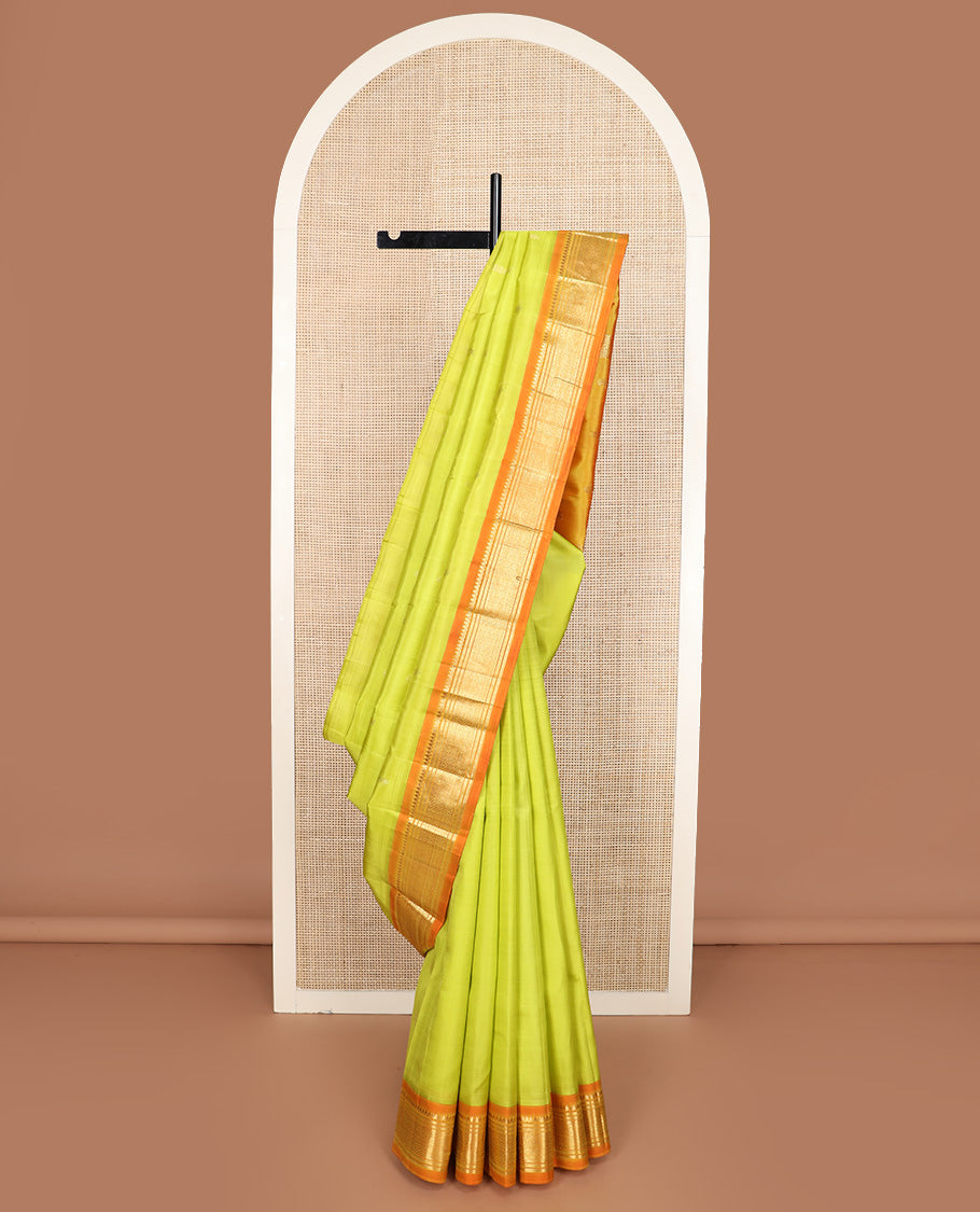 Green zari buttas Kanchipuram silk saree, contrast one-sided korvai border of thilakam mokku, banaras, and jaal design, and zari design pallu