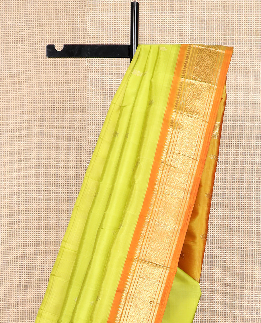 Green zari buttas Kanchipuram silk saree, contrast one-sided korvai border of thilakam mokku, banaras, and jaal design, and zari design pallu