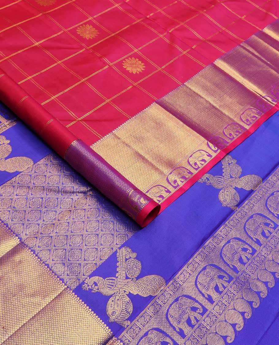 Red annam chakram buttas enclosed checked Kanchipuram silk saree, contrast border of rekku, muthu, mayil kann, and yaanai designs, and pallu of jaal, and peacock in the veena motifs
