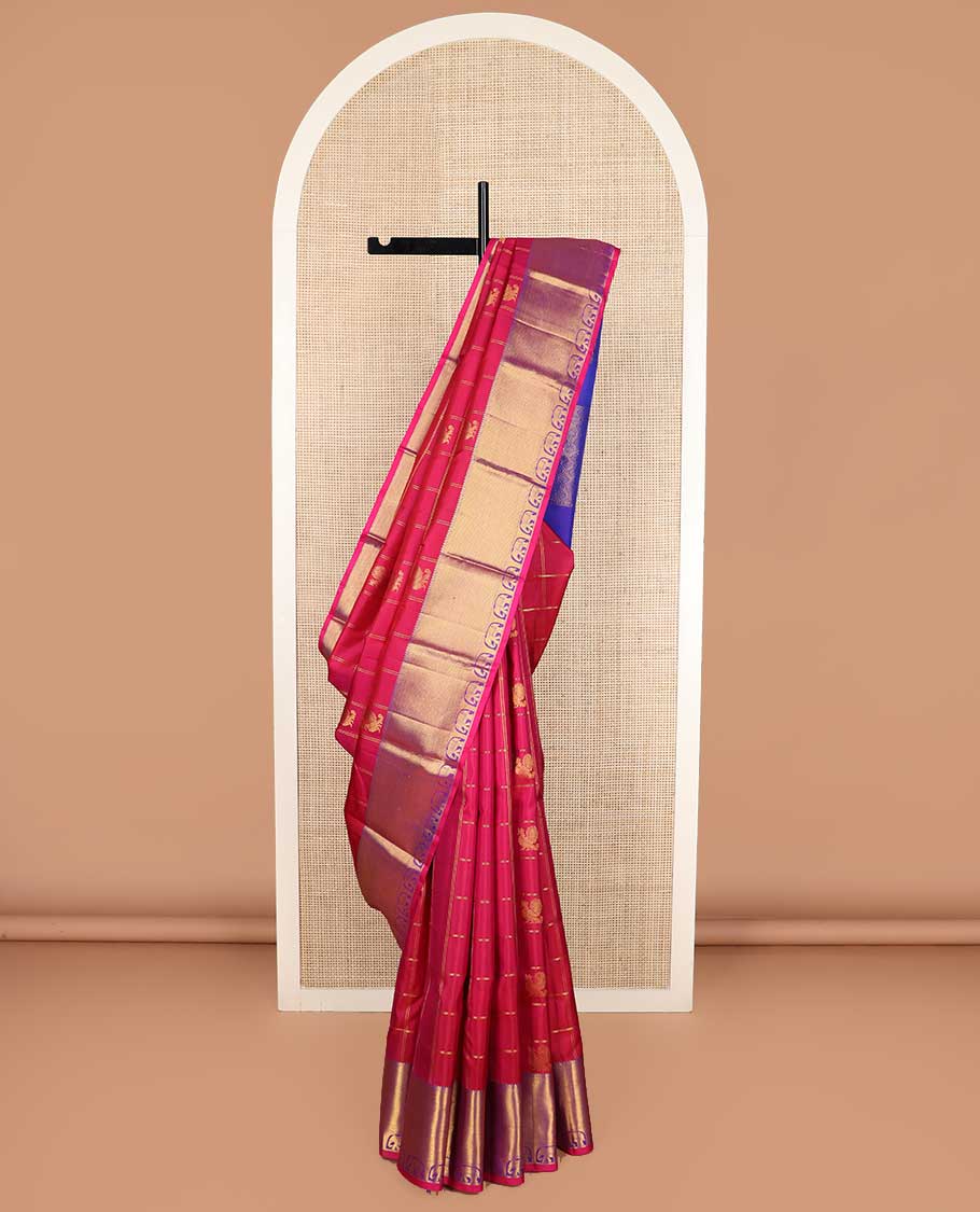 Red annam chakram buttas enclosed checked Kanchipuram silk saree, contrast border of rekku, muthu, mayil kann, and yaanai designs, and pallu of jaal, and peacock in the veena motifs