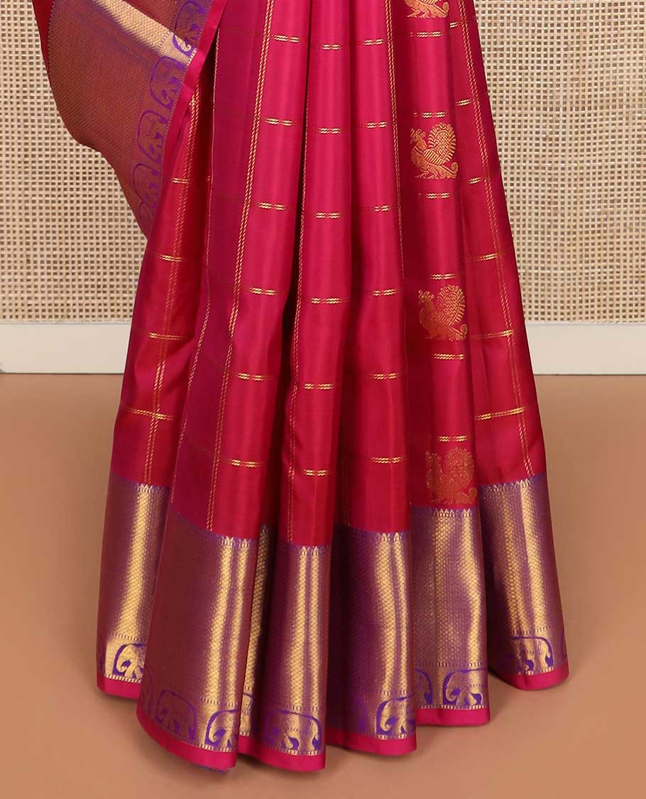 Red annam chakram buttas enclosed checked Kanchipuram silk saree, contrast border of rekku, muthu, mayil kann, and yaanai designs, and pallu of jaal, and peacock in the veena motifs