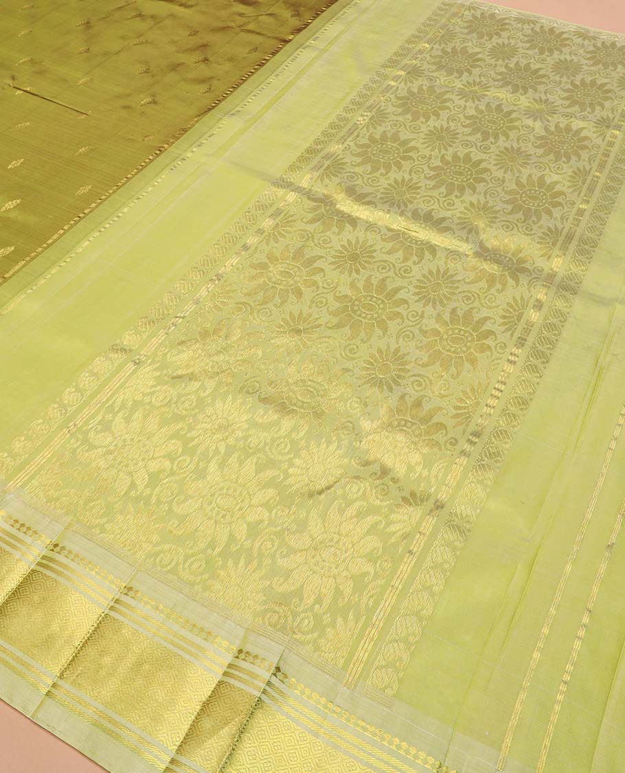 Green zari buttas Kanchipuram silk saree, contrast one-sided border of paneer sombu, banaras, and jaal designs, and floral design pallu