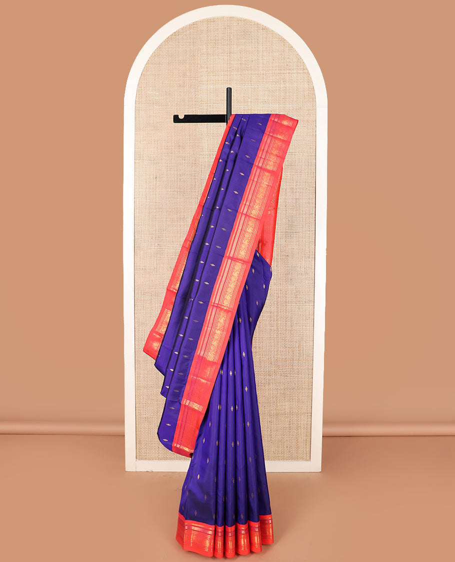 Blue zari buttas Kanchipuram silk saree, contrast border of thilakam mokku, muthu, banaras, and mayil designs, and pallu of intricate designs