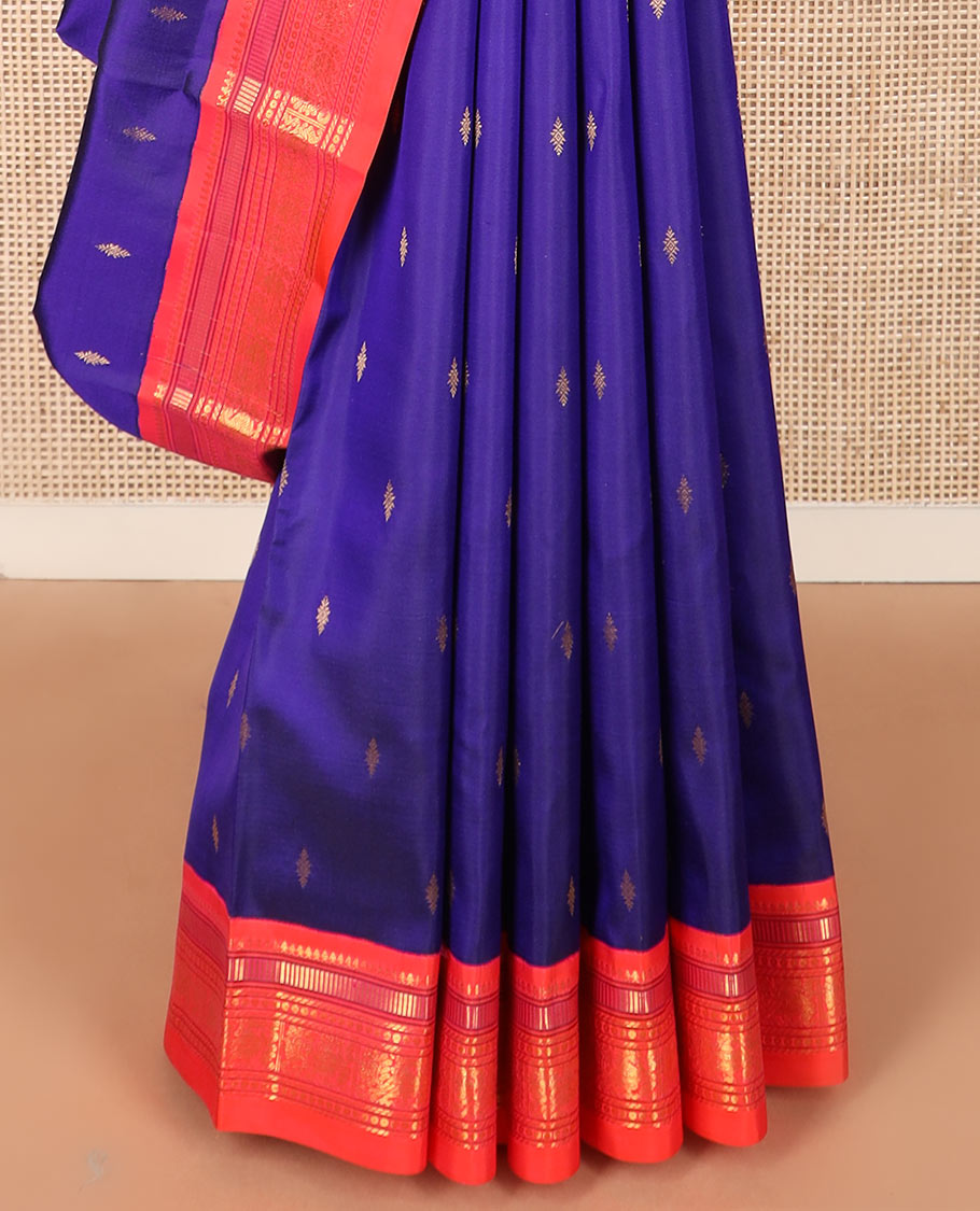 Blue zari buttas Kanchipuram silk saree, contrast border of thilakam mokku, muthu, banaras, and mayil designs, and pallu of intricate designs
