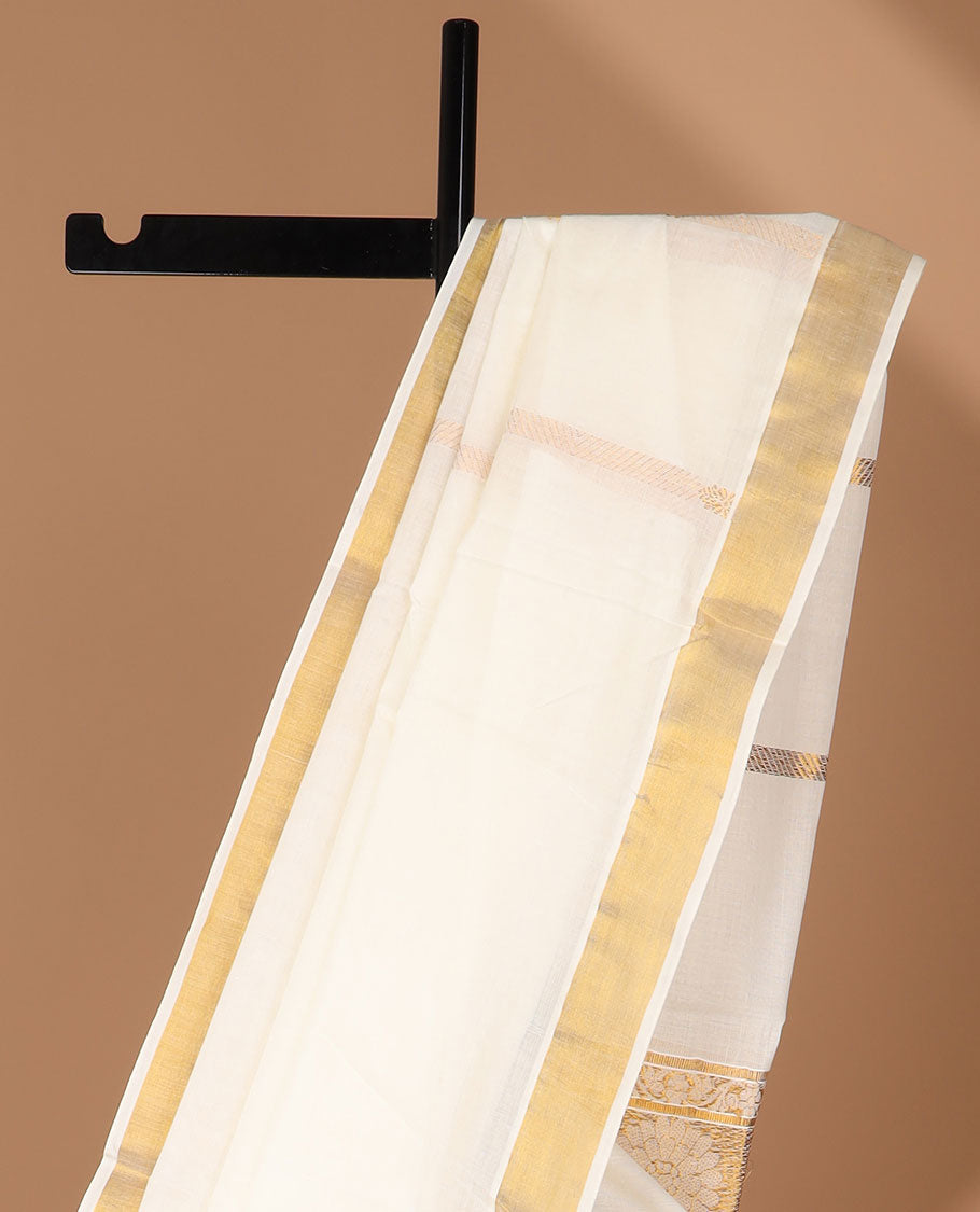 Cream kerala saree with zari designs, zari border & pallu of peacock designs