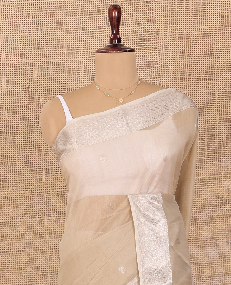 Beige Maheshwari Cotton Saree, Detailed with Flower Buttas All Over Its Body, Highlighted by Traditional Zari Design Border, Pallu Steeped with Flower Buttas, and Paired with a Matching Blouse