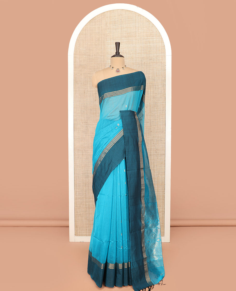 Blue Maheshwari Cotton Saree Adorned with Zari Buttas, Highlighted with Contrast Zari Leaf Striped Border, Pallu Scintillated with Jaal Designs, and Paired with a Matching Blouse