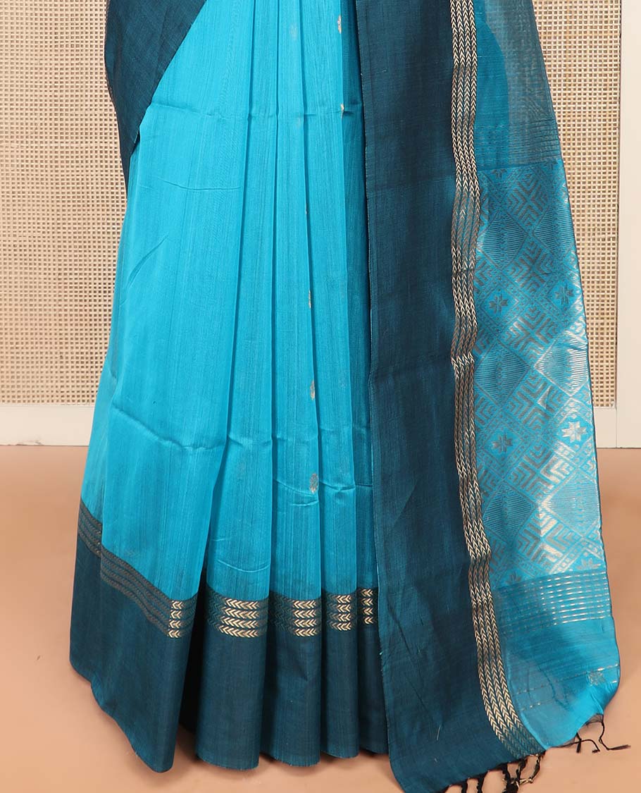 Blue Maheshwari Cotton Saree Adorned with Zari Buttas, Highlighted with Contrast Zari Leaf Striped Border, Pallu Scintillated with Jaal Designs, and Paired with a Matching Blouse