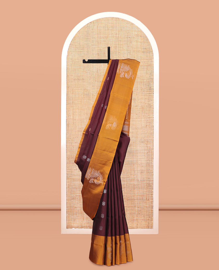 Maroon Mayuri Lite Silk Mix Saree, Bedecked with Zari Buttas, Complemented By Contrast Peacock Buttas Border, a Floral Vine Pallu, and a Contrast Blouse