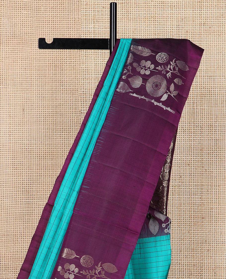 Blue checked soft silk saree, contrast unique-shaped floral & leaf motif border & pallu steeped with unique-shaped floral & leaf motifs