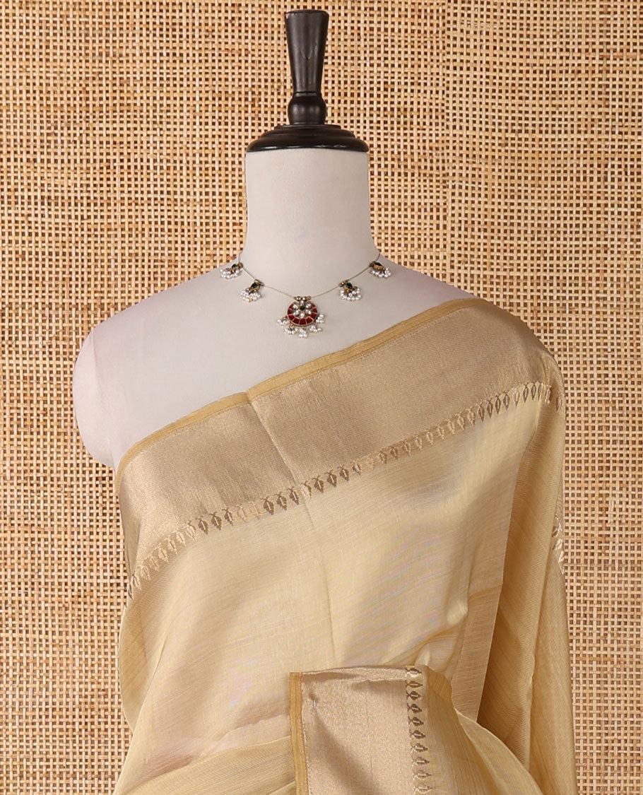 Cream full-plain tissue silk saree, zari bavanji border of thilakam mokku, zari pallu & running self-color blouse