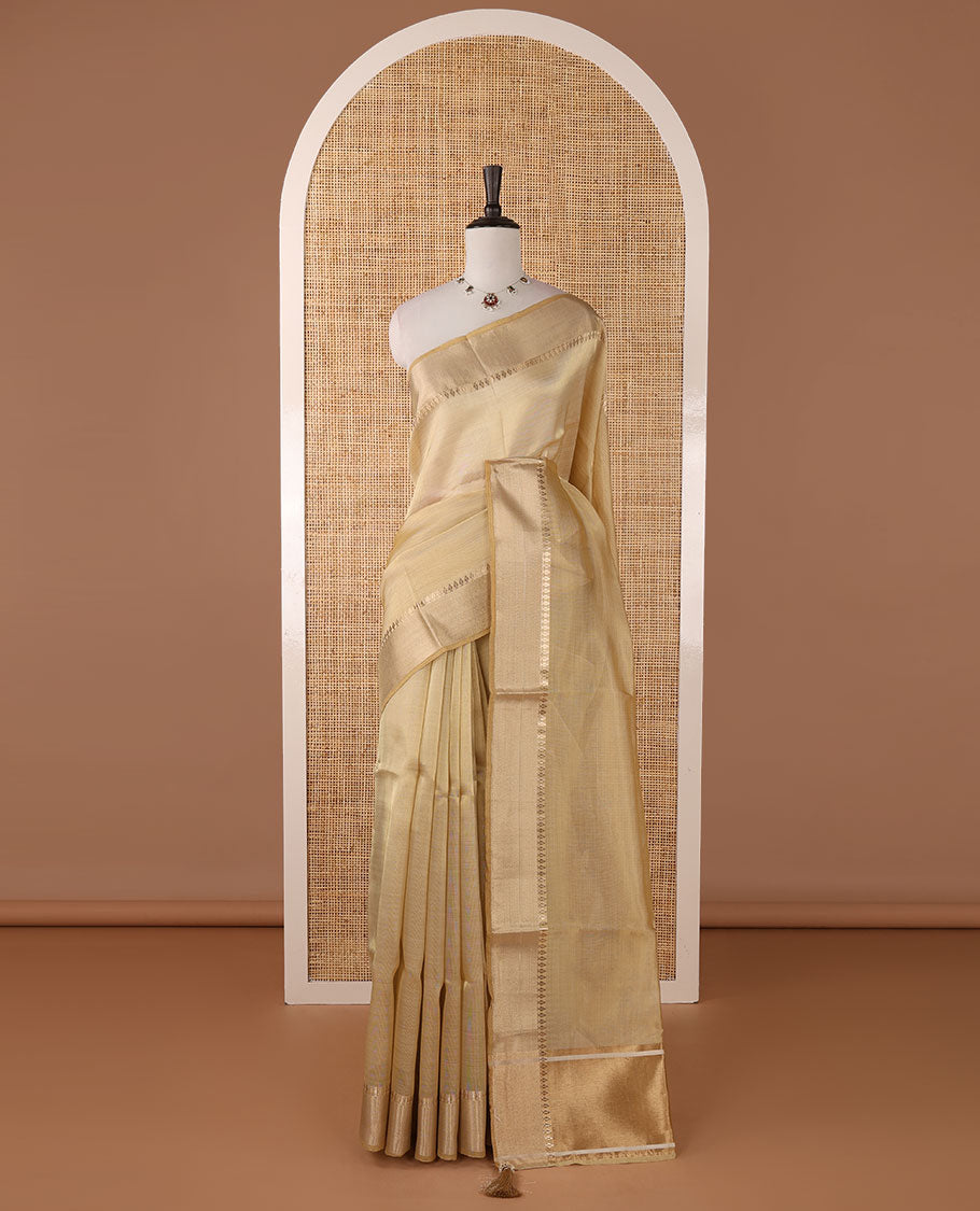 Cream full-plain tissue silk saree, zari bavanji border of thilakam mokku, zari pallu & running self-color blouse