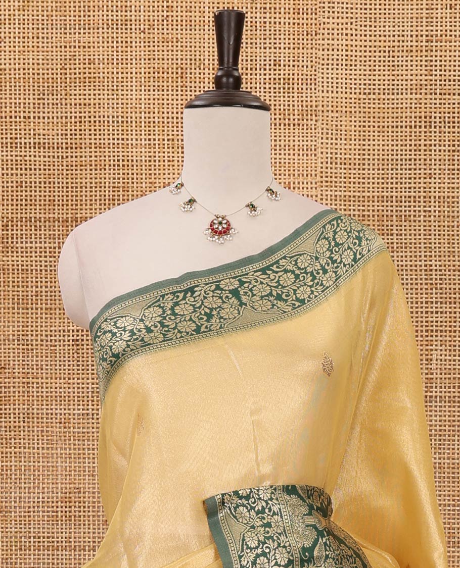 Yellow Antique buttas twill tissue saree, contrast satin thread woven border & pallu of mughal-style motifs & buttas dark green blouse