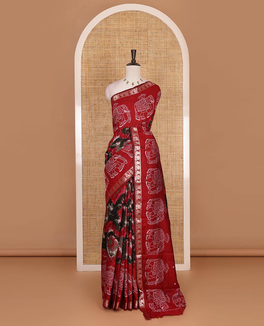 Red-black shibori printed muslin cotton saree, contrast batik elephant print border of zari annam, batik elephant pallu, and contrast polka dots print blouse