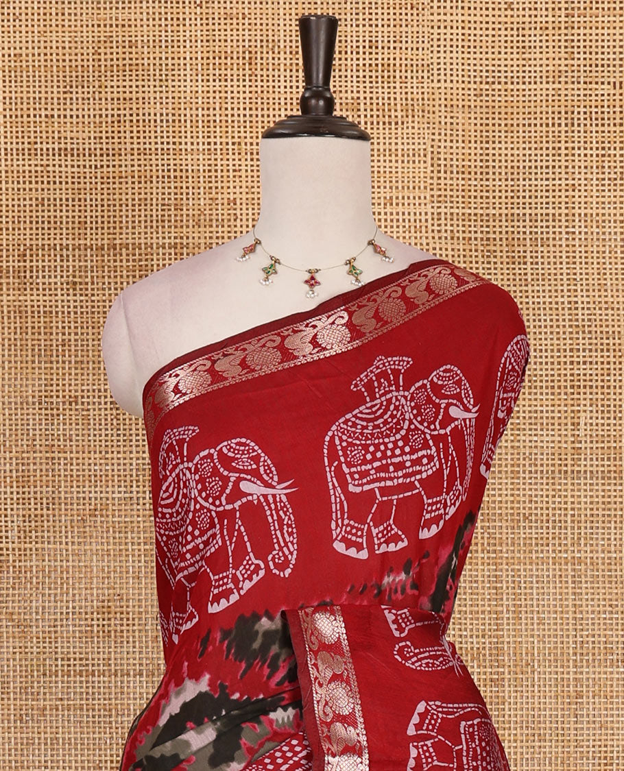 Red-black shibori printed muslin cotton saree, contrast batik elephant print border of zari annam, batik elephant pallu, and contrast polka dots print blouse