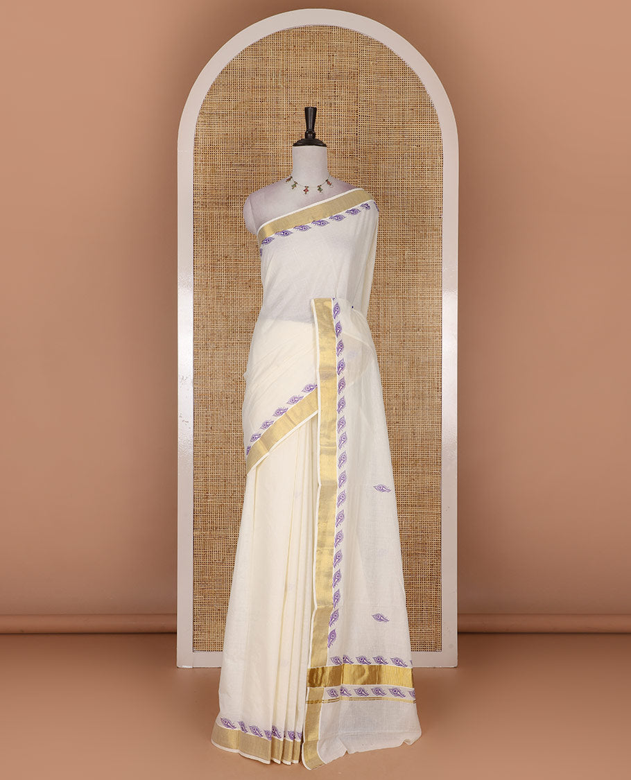 Half-white peacock feather motifs printed Kerala cotton saree, gold zari border, peacock feather printed pallu, and matching blouse