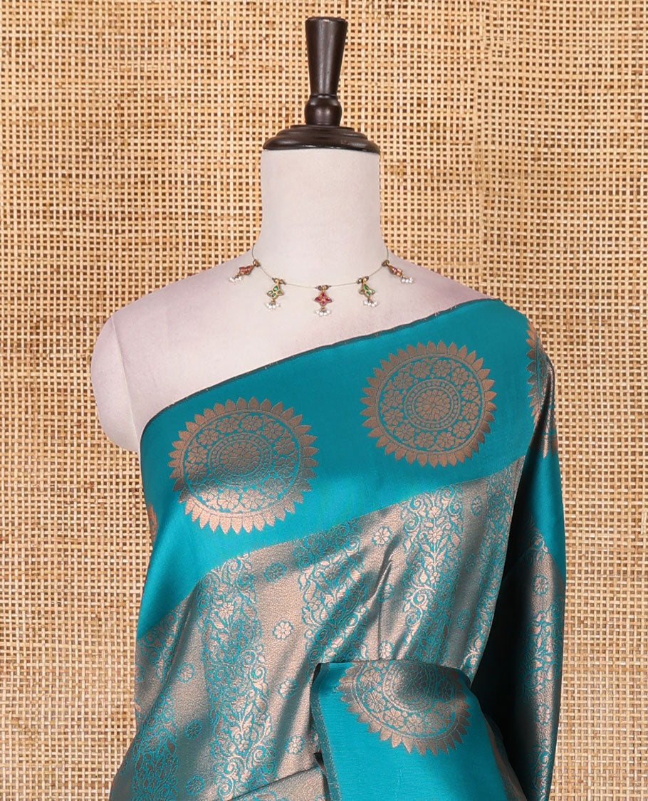 Rama green jacquard kanchi tissue saree, zari chakram motifs border, intricately zari woven pallu, and a matching zari design blouse