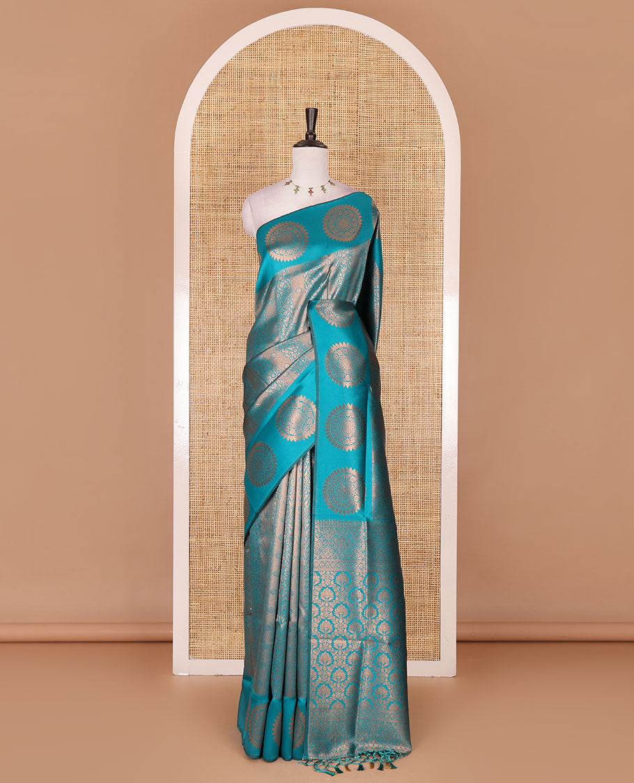 Rama green jacquard kanchi tissue saree, zari chakram motifs border, intricately zari woven pallu, and a matching zari design blouse