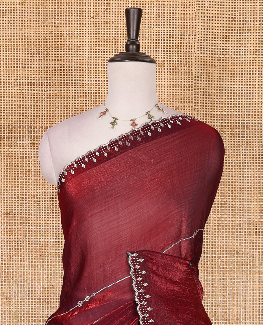 Maroon micro stonework Fendi chiffon saree, scallop micro stonework border, stonework paisley pallu, and matching micro stone work blouse