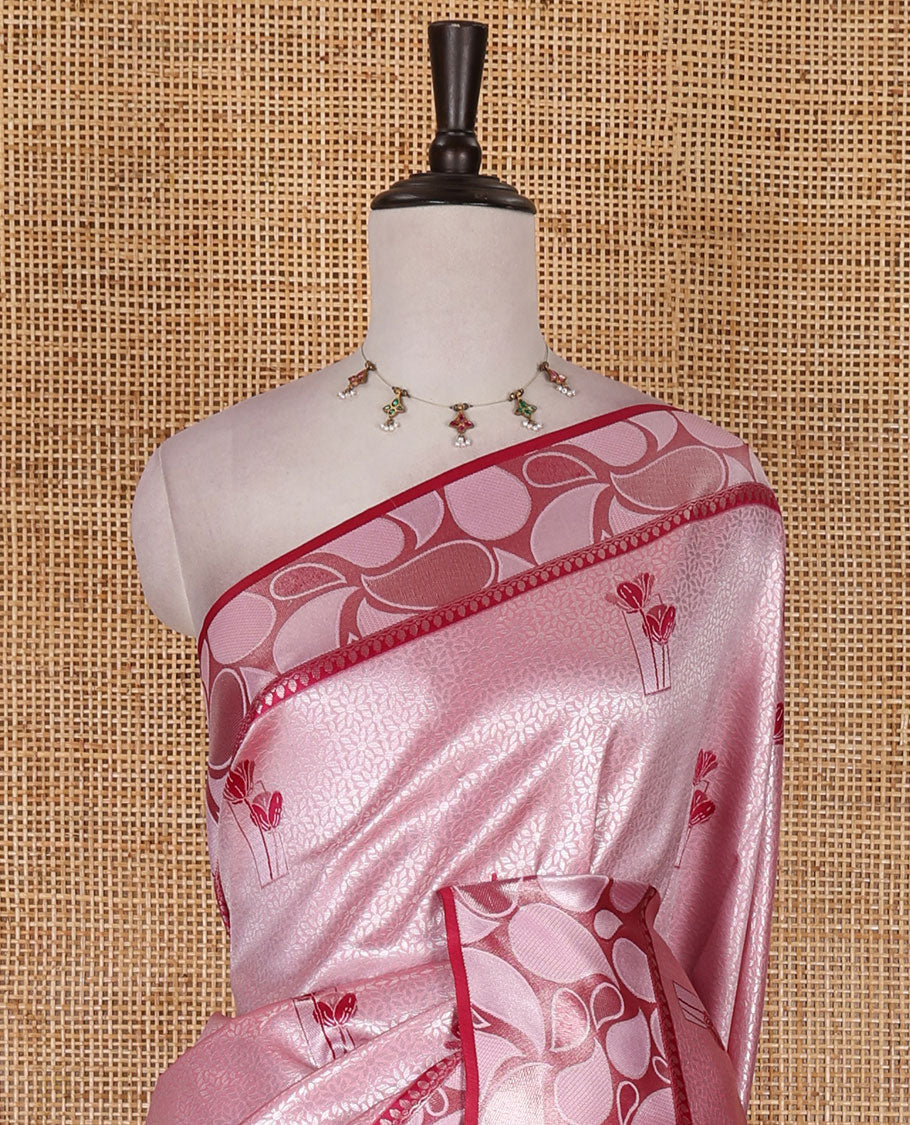 Pink jacquard kanchi silk saree, contrast border, and pallu steeped with paisley motifs with contrast zari design blouse