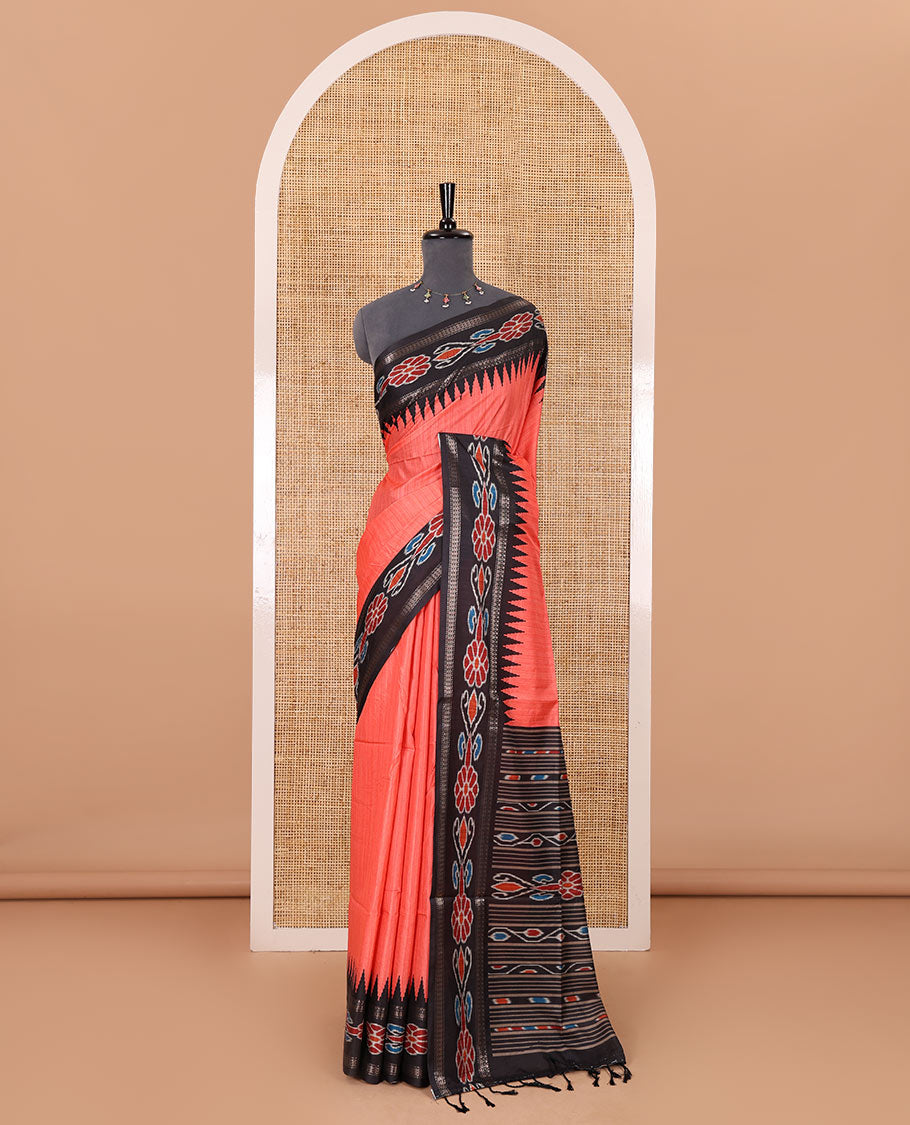 Tomato pink plain Katan silk saree, contrast temple ikkat floral printed border, ikkat floral printed pallu, and ikkat printed blouse