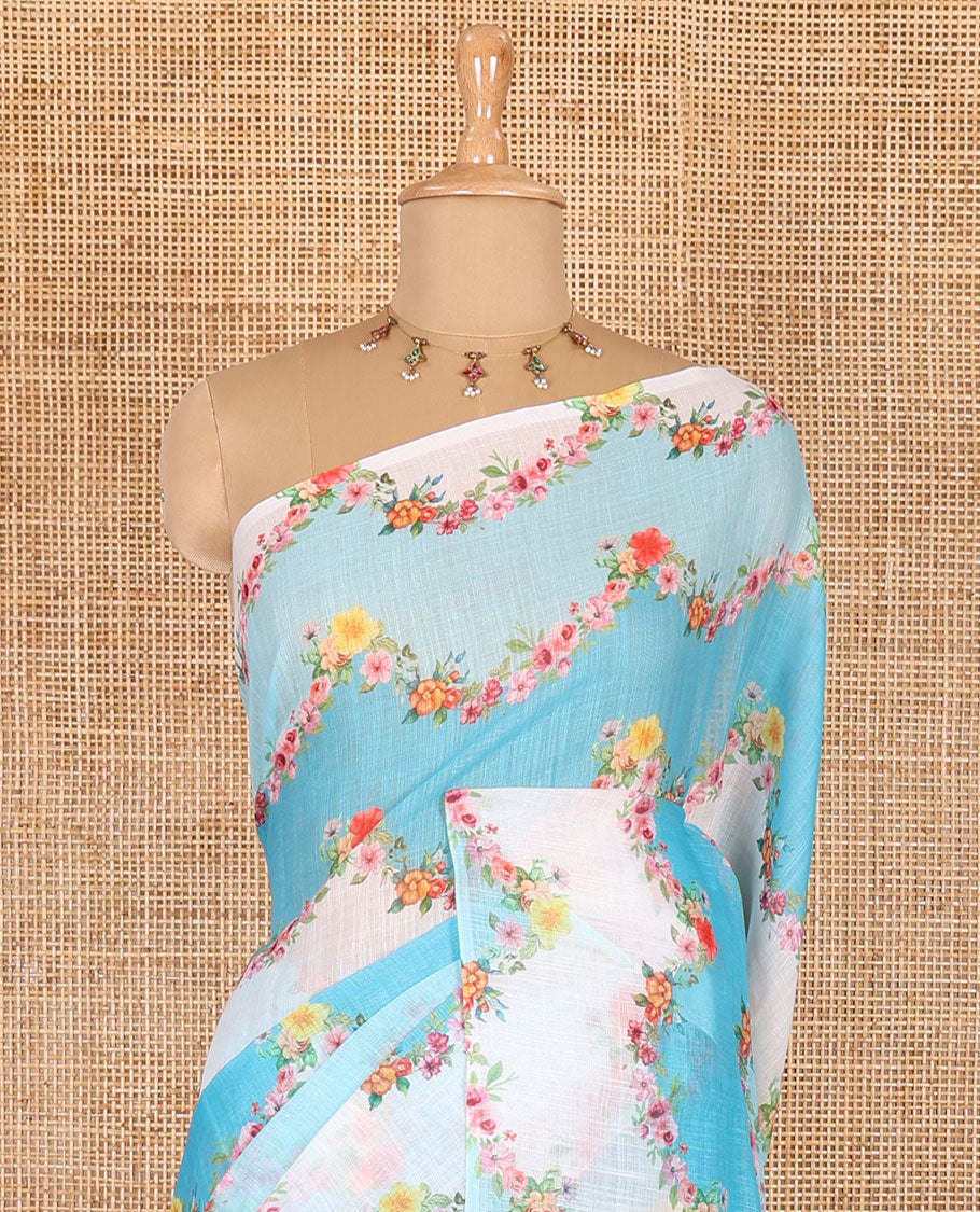 Borderless blue rangkat style dyed and floral printed linen cotton saree with a contrast printed blouse