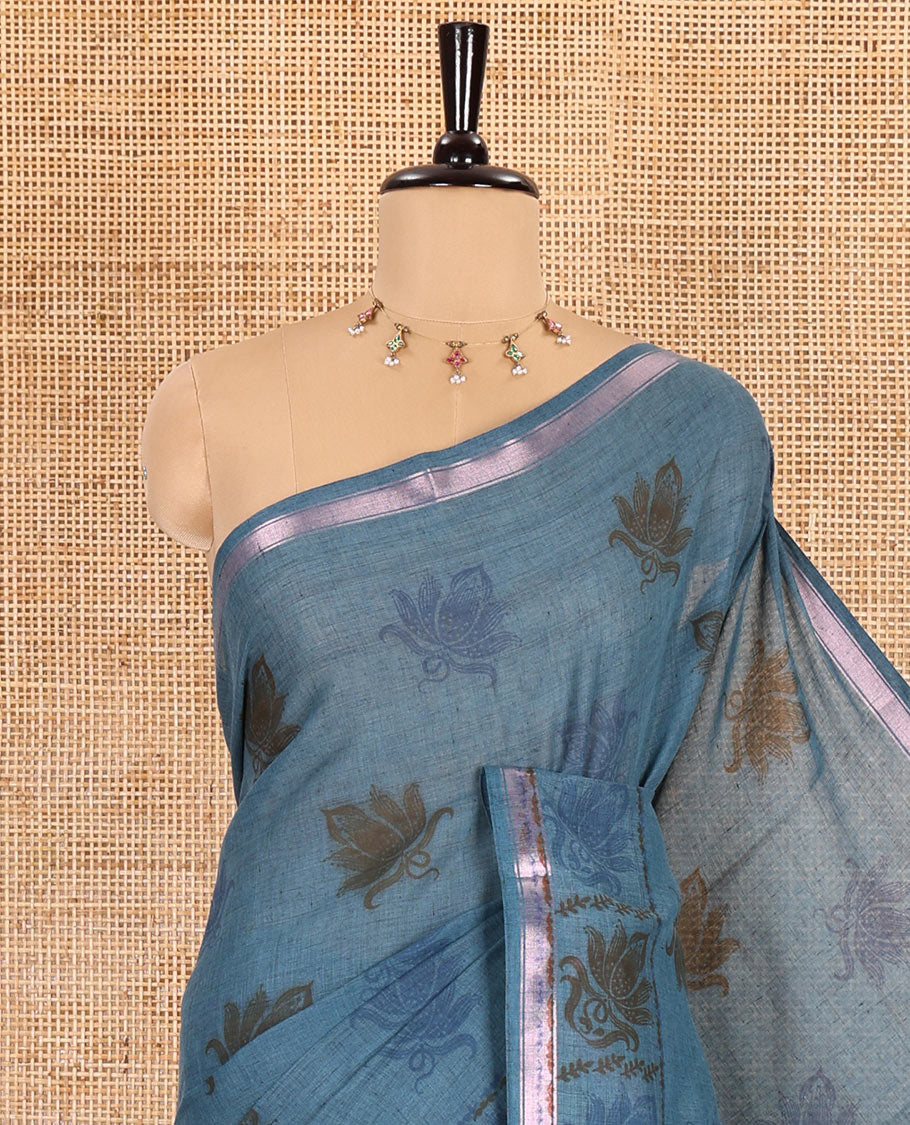 Sky blue lotus printed soft cotton saree, piping border, printed pallu, and a shibori printed blouse of polka dots
