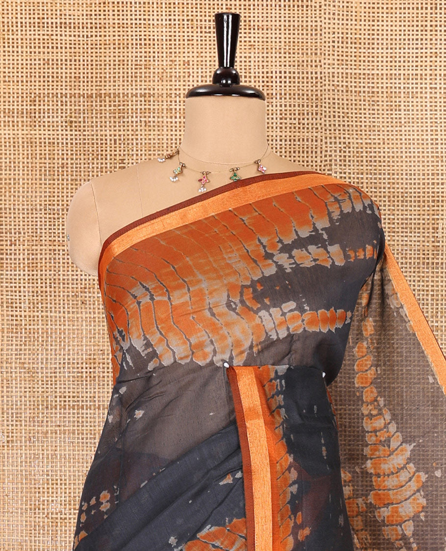 Black shibori printed muslin cotton saree, contrast gold zari border, shibori printed pallu, and shibori printed blouse