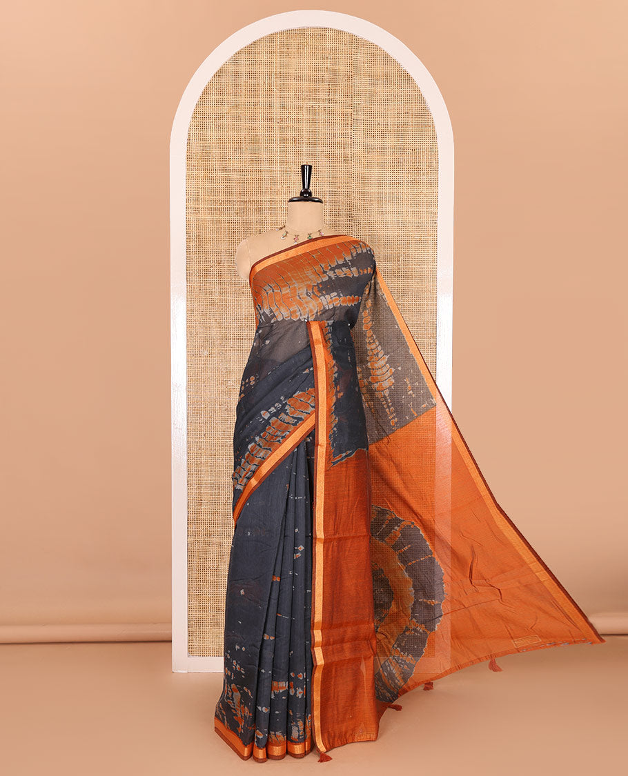 Black shibori printed muslin cotton saree, contrast gold zari border, shibori printed pallu, and shibori printed blouse