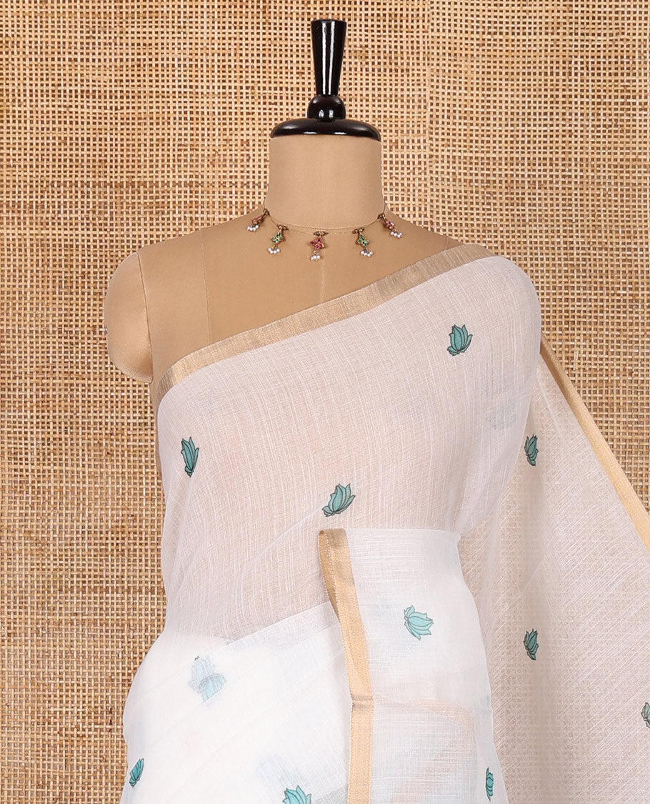 White lotus motifs printed linen saree, piping border, contrast floral vine printed pallu, and contrast printed blouse