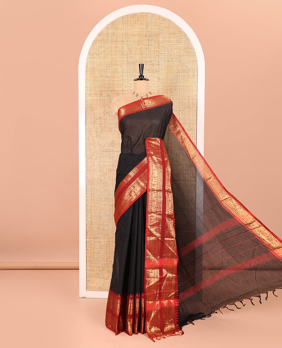 Black Plain Chettinad Cotton Saree Elevated with a Contrasting Temple Rettai Pettu Border of Peacock-Elephant Motifs, a Subtle Pallu of Stripes, and a Matching Blouse