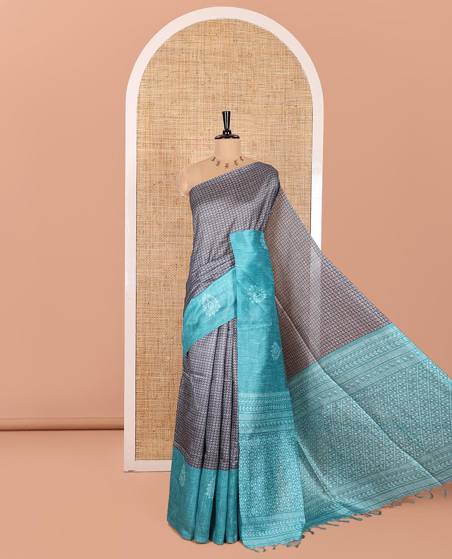 Grey and Rama Semi-Tussar Saree, Prettified with Geometric Patterns Printed All Over Its Body, Complemented by a Captivating Contrast One-Sided Border of Unique Print, and Paired with a Contrast Blouse
