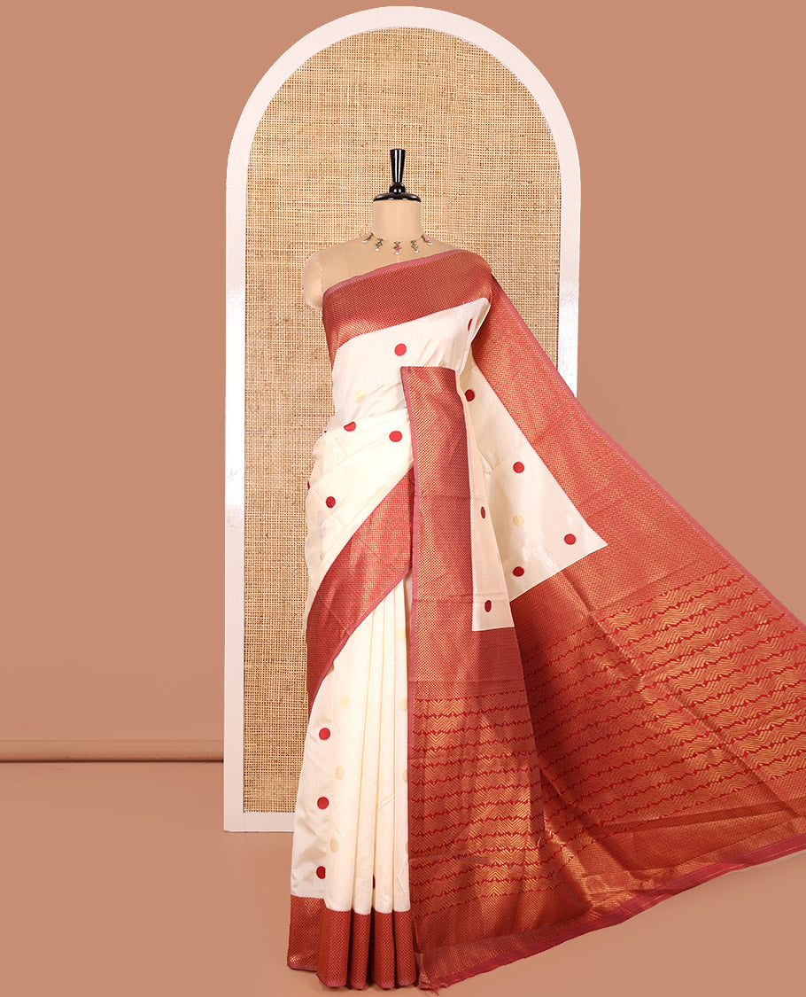 Cream and Red Semi-Soft Silk Saree Embellished with Polka Dot Buttas All Over Its Body, Complemented by a Contrast Jaal Design Border, Pallu of Geometric Patterns, and Paired with a Contrast Blouse