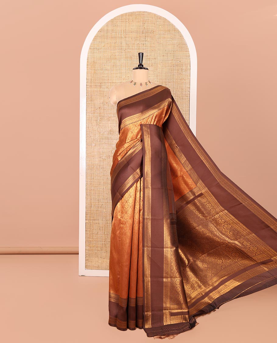 Rust Orange Kanchi Silk Saree, Highlighted with Jacquard Zari Design All Over Its Body, Complemented by a Contrast Rettai Pettu Traditional Zari Border, Opulently Embellished Pallu, and Paired with a Contrast Jacquard Blouse