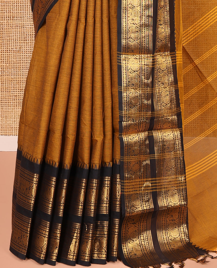 Mustard Plain Chettinad Cotton Saree, Complemented by a Contrast Rettai Pettu Zari Border of Thread-Temple, Coin, Elephant, and Peacock Designs, Subtly Striped Pallu, and Paired with a Matching Blouse