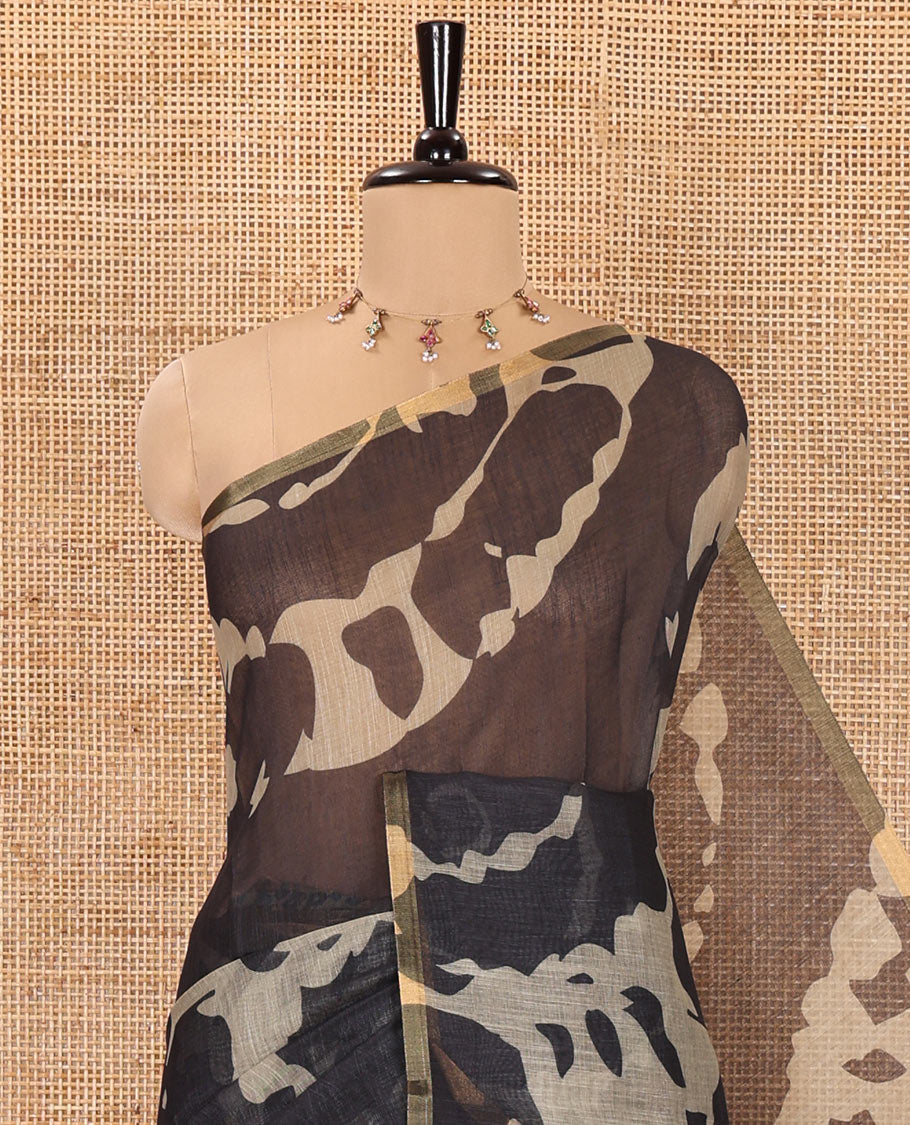 Black Linen Saree, Accentuated with Abstract-Style Print on Its Body, Subtle Piping Border, Captivating Pallu of Floral Vine Print, and Paired with a Contrast Floral Printed Blouse